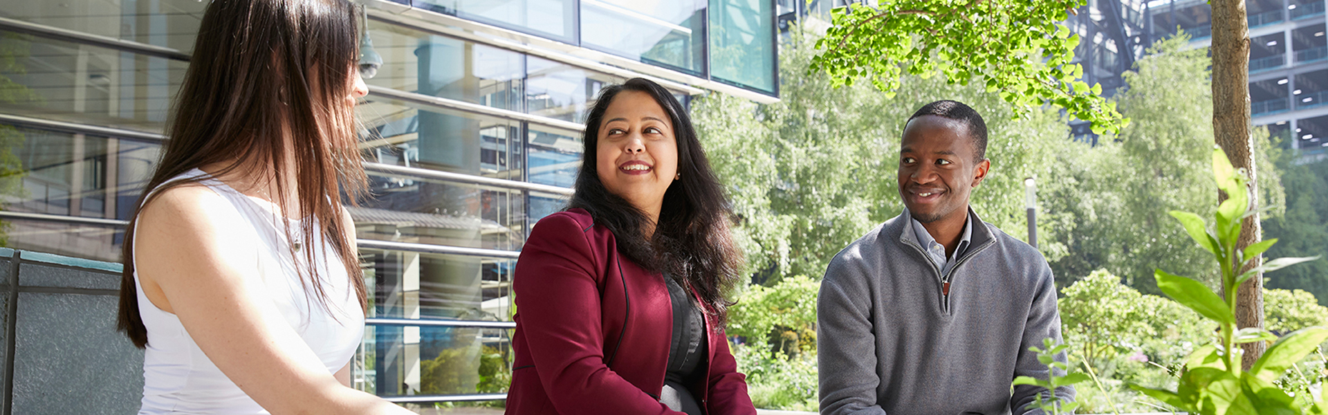SMBC Employee on laptop in conference room